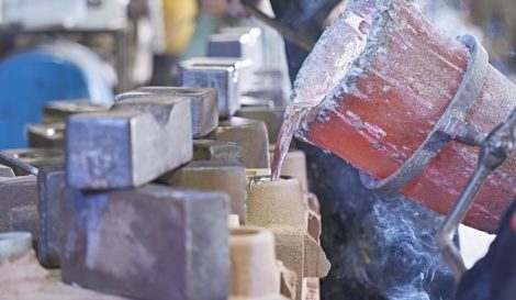 Pouring Aluminium into sand moulds